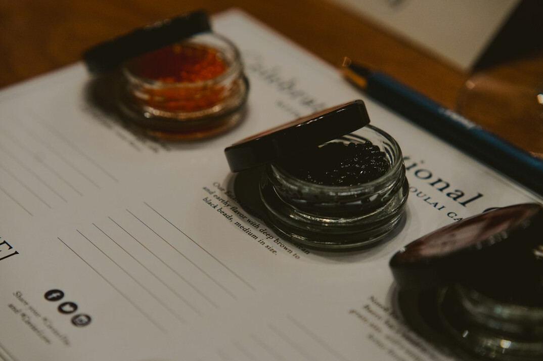 Close-up of a signed contract document with an official stamp and pen