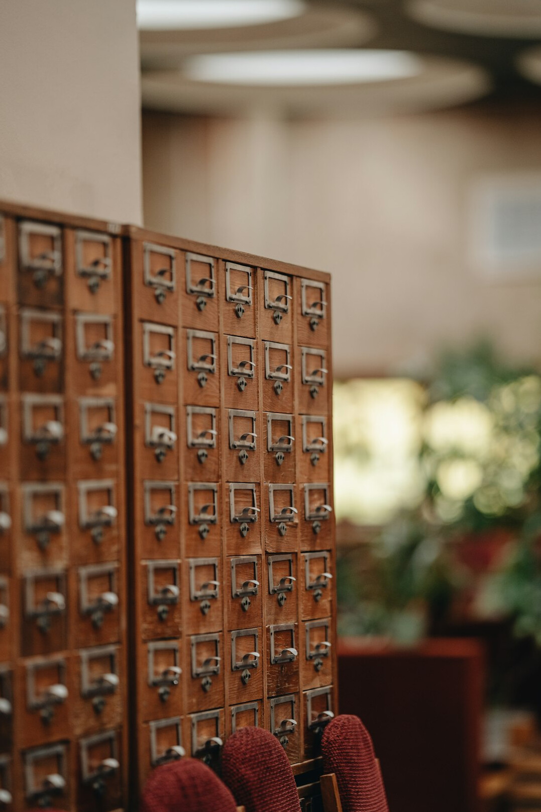 Open filing cabinet with labeled folders in an archive room