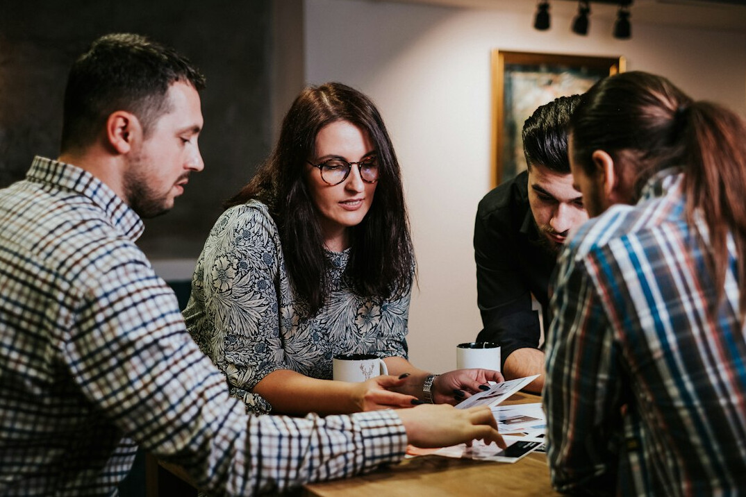 people reviewing documents together